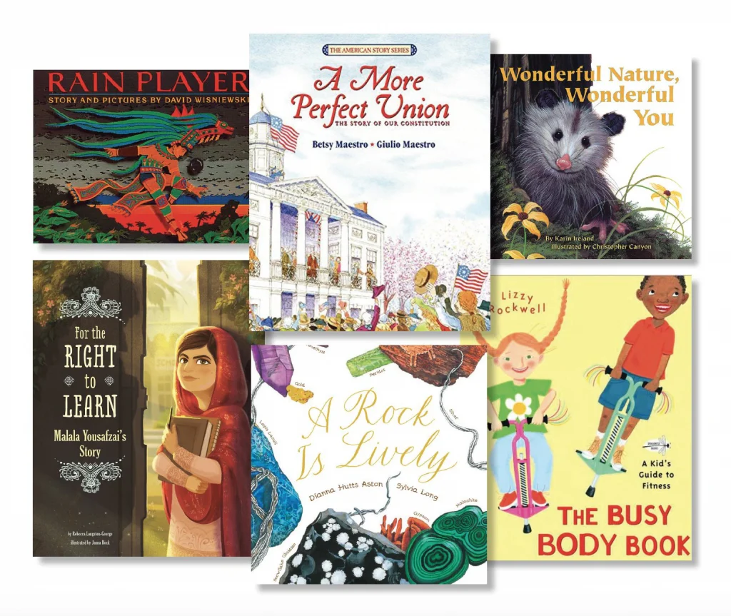Six children's book covers arranged in two rows, featuring colorful illustrations of animals, people, and nature. Titles include "Rain Player," "A More Perfect Union," and "The Busy Body Book.