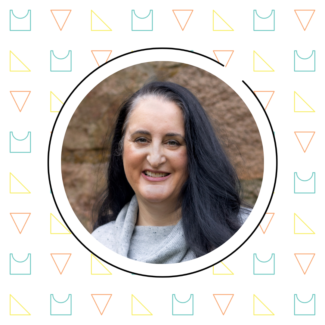 A smiling woman with long dark hair, wearing a grey scarf, centered within a circular frame surrounded by a pattern of black cats and math anxiety symbols.