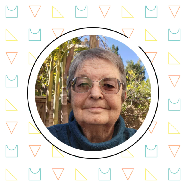 Elderly woman with glasses smiling at the camera, framed by a circle with a geometric patterned border on a garden background, exemplifying what is math fluency.