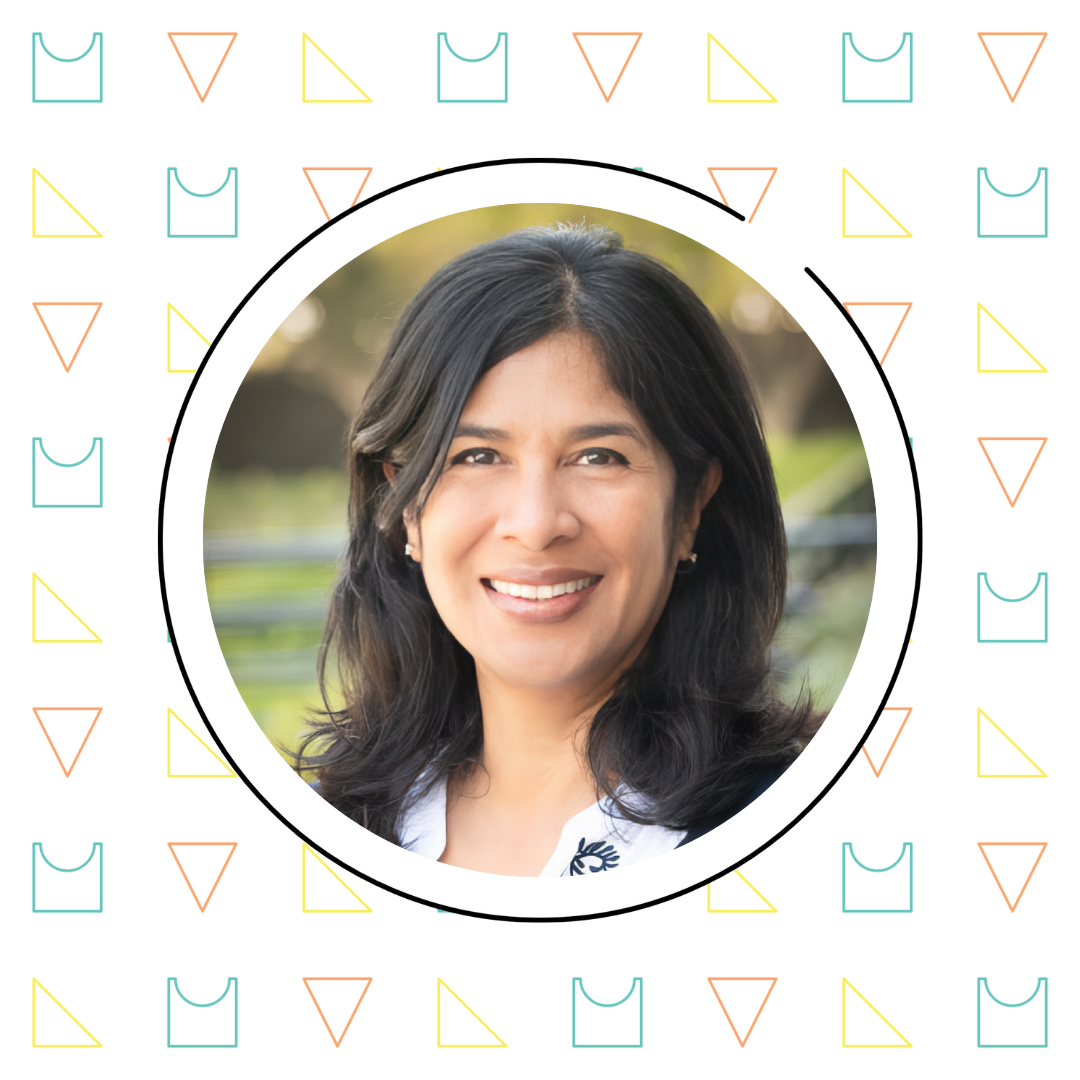 A person with long dark hair smiles at the camera, framed in a circular border. The background features a pattern of colorful triangles and squares.