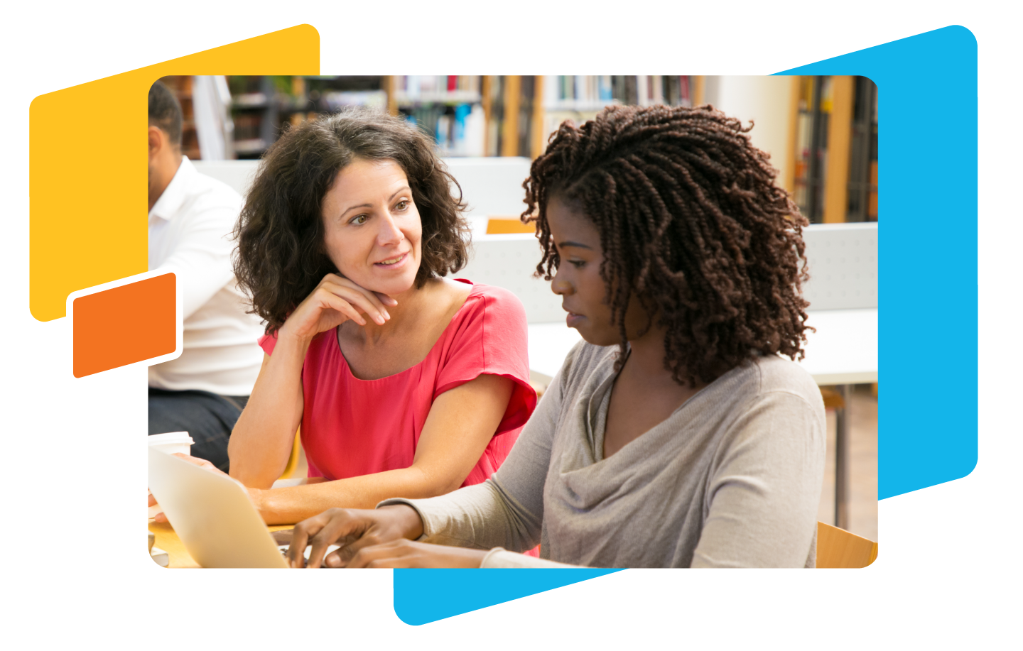 Two women seated at a table engage in a lively conversation. One is using a laptop, likely discussing innovative teaching practices. Bookshelves filled with resources for empowering students are visible in the background, perhaps hinting at their dedication to star awards in education.