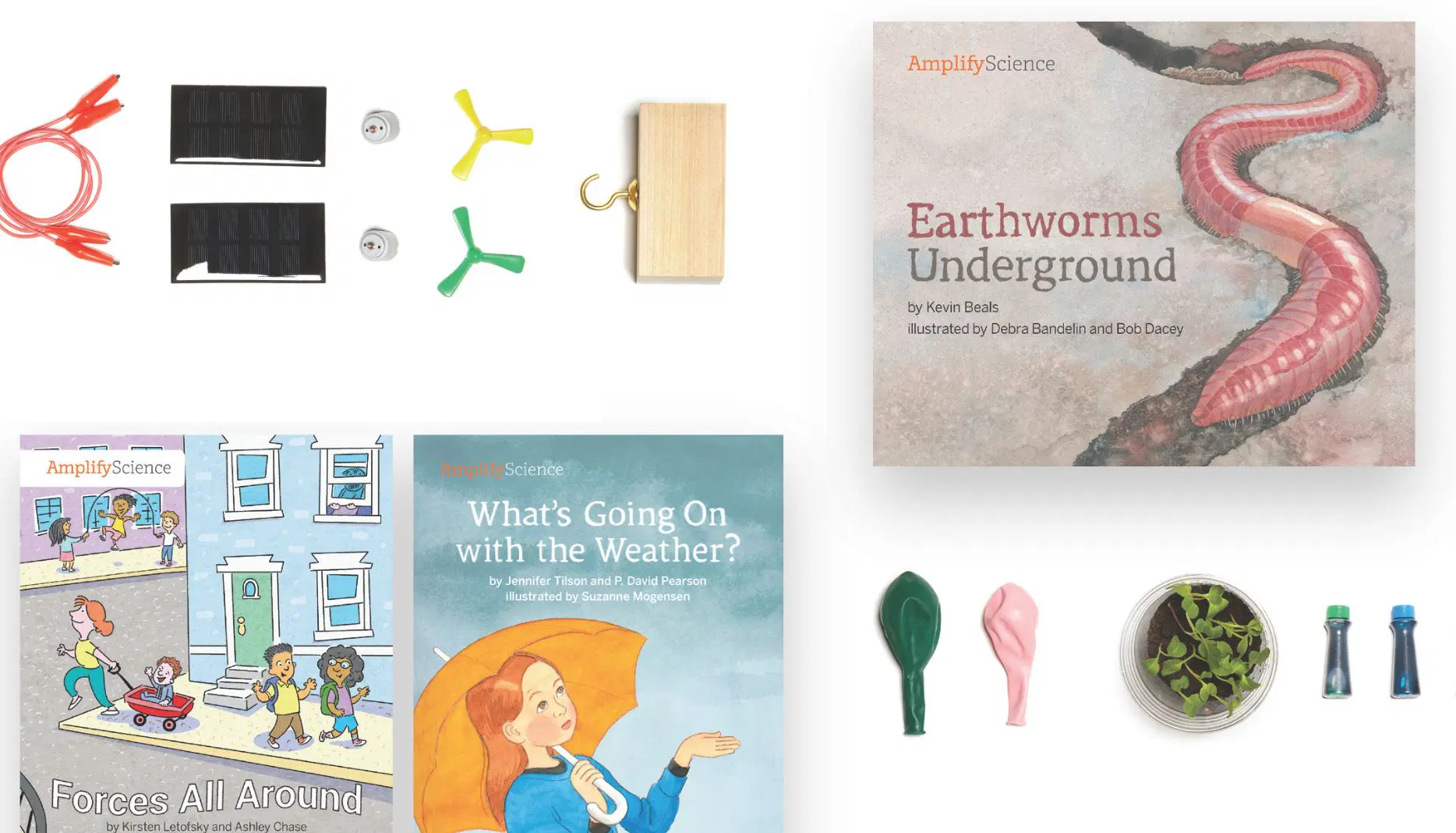 A collection of science learning materials including books, balloons, seeds, windmill parts, and other educational tools arranged on a white surface.