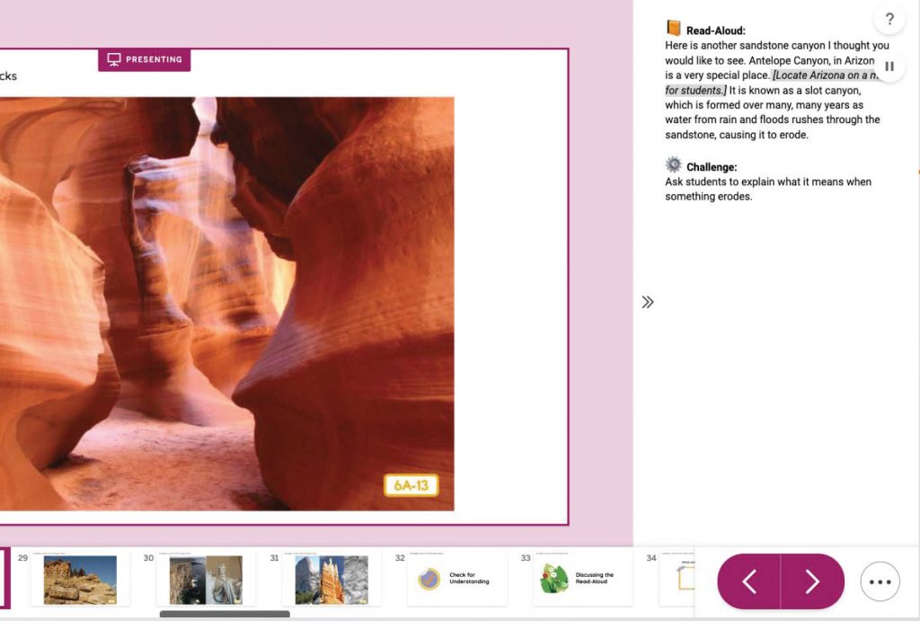 A person navigating through the curved, narrow sandstone walls of antelope canyon. the natural rock formation casts pink and orange hues.