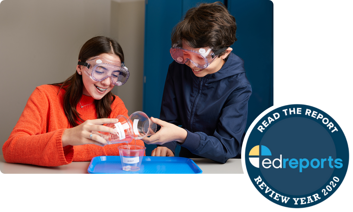 Two teenagers wearing safety goggles conduct a science experiment with beakers and liquids on a table, under an "EdReports 2020 Review" text banner.