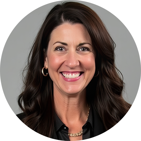 Smiling woman with long brown hair, wearing a black shirt and hoop earrings, against a gray background.