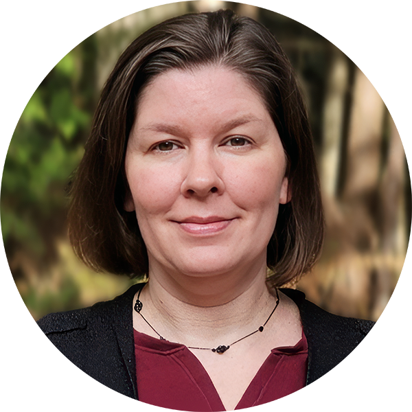 A person with short, brown hair wearing a maroon shirt and black cardigan is shown in a circular portrait with a blurred nature background.