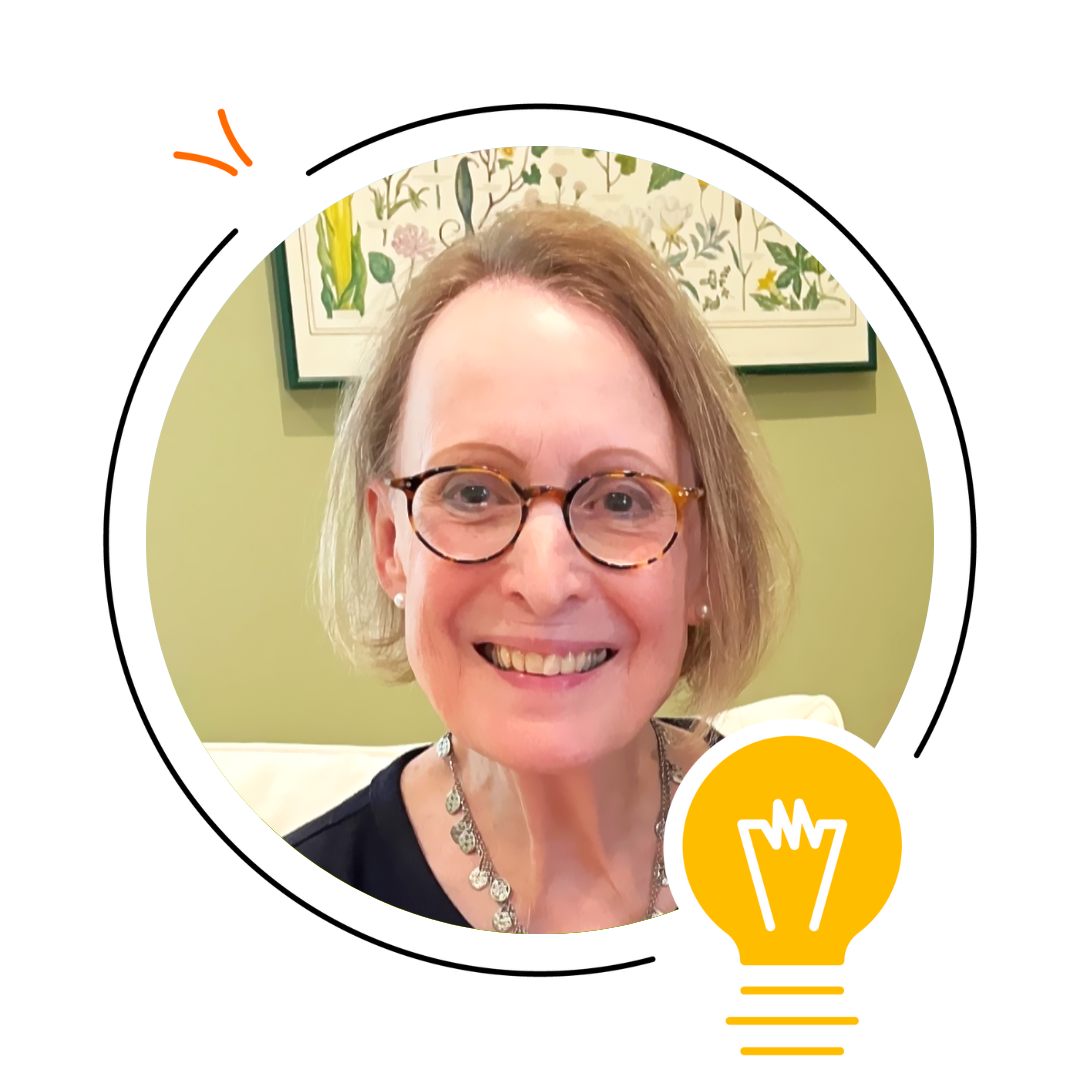 A smiling woman with glasses and a necklace sits in front of a green wall with a botanical print, illustrating concepts in literacy instruction; a graphic of a yellow lightbulb is in the lower right corner.