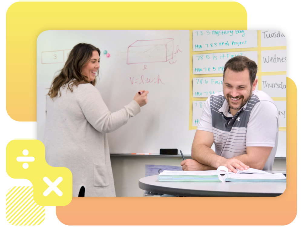 A woman writing on a whiteboard.