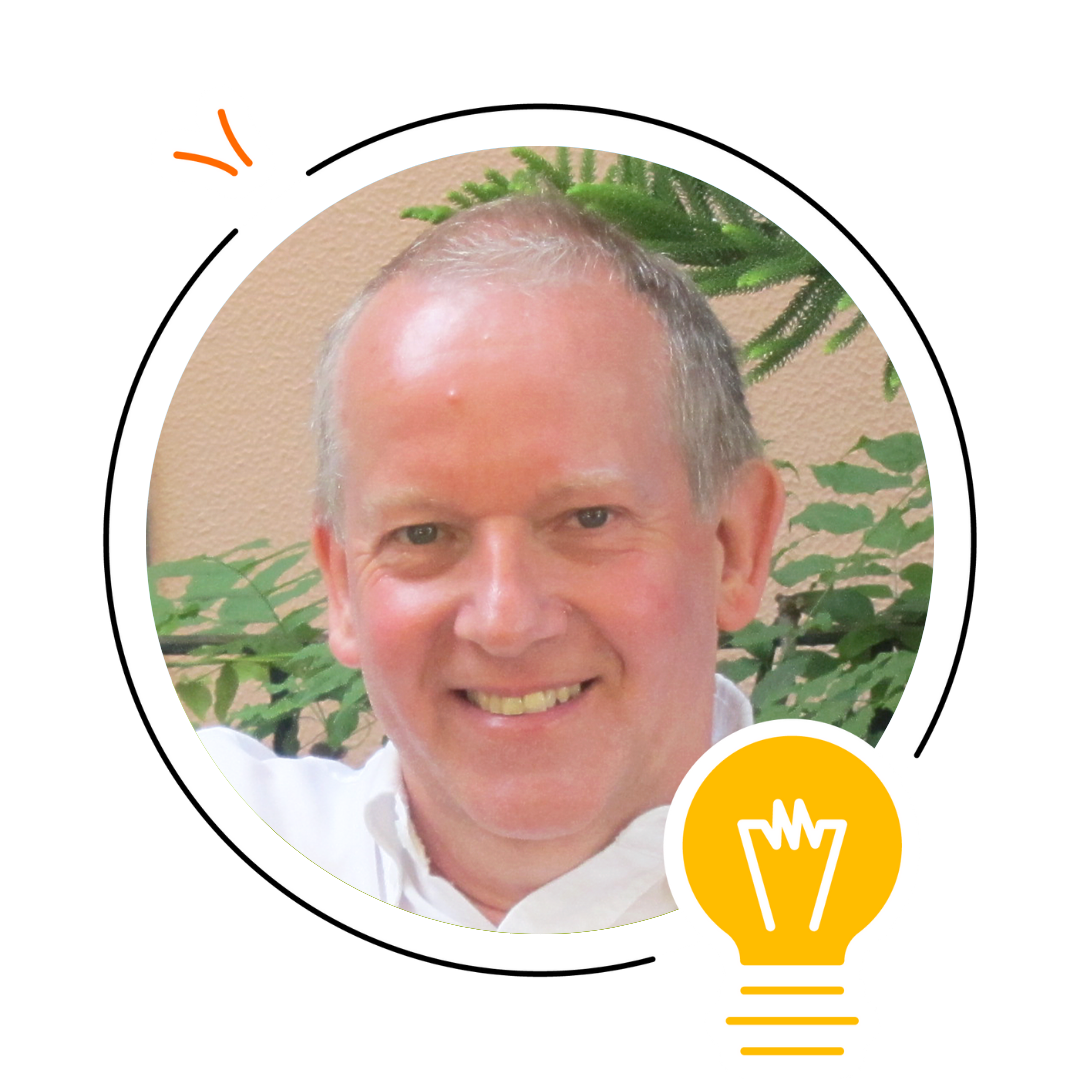 A smiling older man with short gray hair poses in front of green plants, highlighting themes of language development. A lightbulb graphic and circular frame decorate the photo.